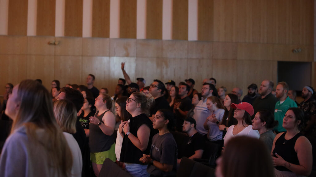 young adults worshipping in the chapel